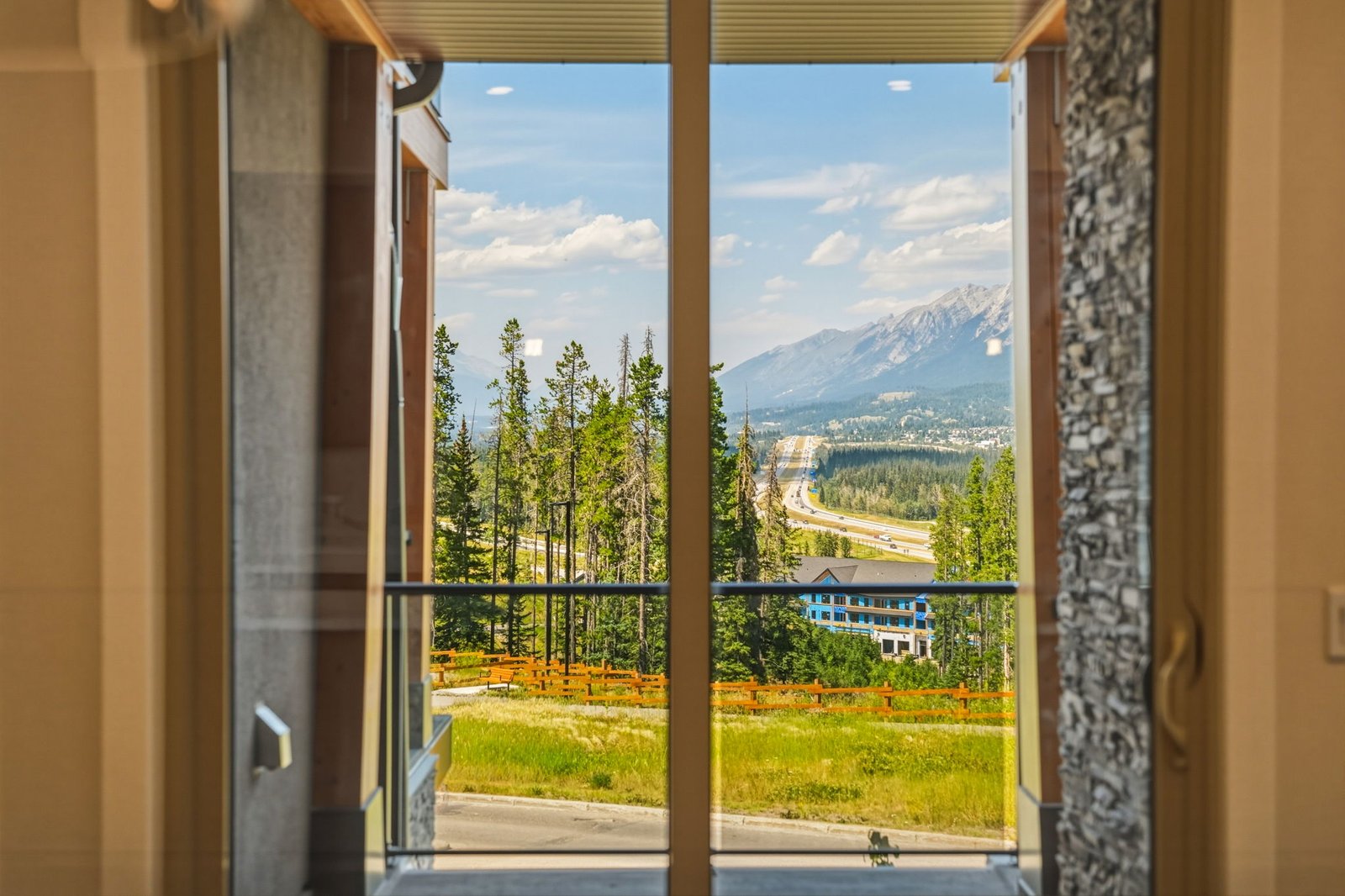 Bedroom with mountain outlook in a completed residence at The Summit Collection